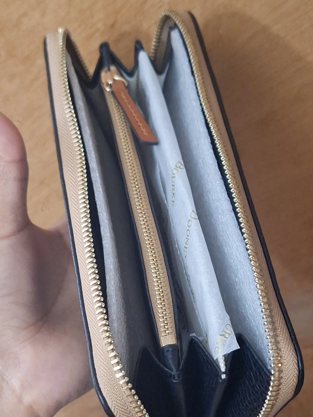 Dooney & Bourke Black Pebbled Zip Wallet with Tan Trim